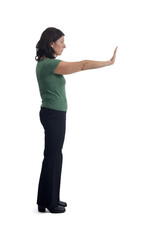 side view of a woman showing the stop sign with their hands on white background