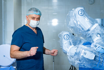 Surgery specialist with new technology surgery robot. Da vinci healthcare emergency equipment.