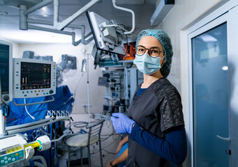 Portrait of surgery specialist in sterile mask. Professional operation assistant. - obrazy, fototapety, plakaty