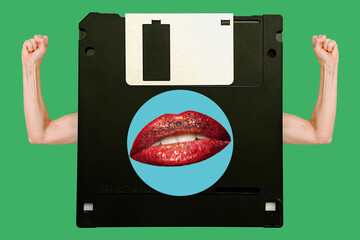 Floppy disk isolated on green background