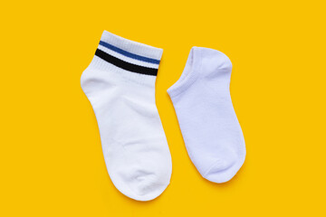 White socks on yellow background.