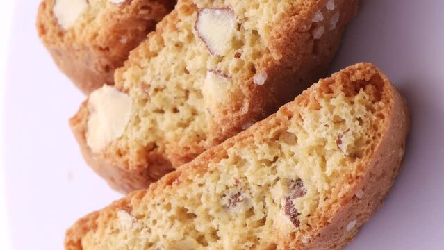 Italian traditional cantucci cookies with almonds, rotation in circle. cantucci Turning. selective focus. Vertical video