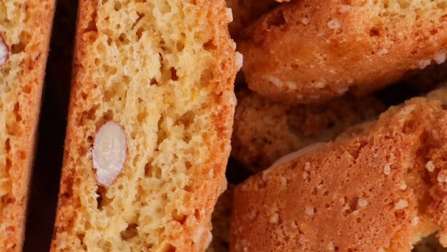 Italian traditional cantucci cookies with almonds, rotation in circle. cantucci Turning. selective focus. Vertical video