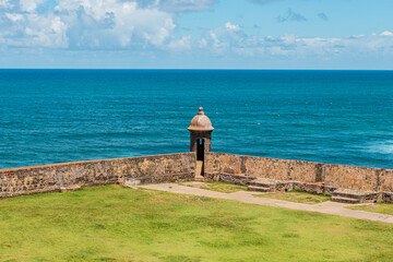 View to the sea with the puerto rico guard vigilance tower on the middle with green field from el...