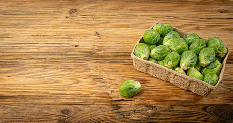 Brussels Sprouts on Wood Background, Brassica Oleracea Cabbage Pile