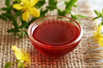 A bowl of red oil made from St. John's wort flowers