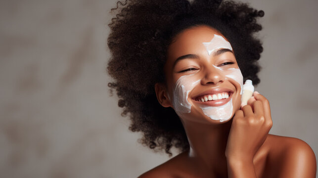 Smiling African American Woman In Grey Background Enjoying. Applying Face Cream For Skin Care Rutine. Copy Space