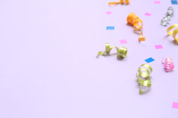 Colorful on confetti on lilac background