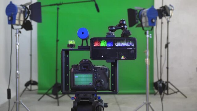Creating videos Studio with camera, lights, microphone and green screen. Concept of creating multimedia content for social networks.