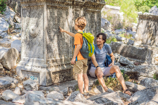 Father and son tourists explores Stunning Ancient Theater of Termessos Ancient City. Traveling with kids concept. turkiye, GO Everywhere