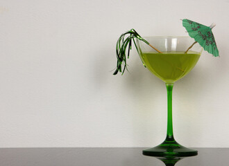 green cocktail with lime