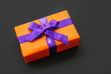Beautiful gift box for Halloween on dark background