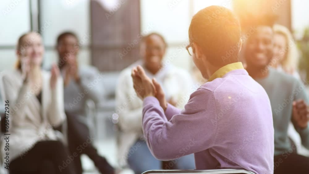 Wall mural Seminar business meeting applause speaker. Crowded smiling audience clapping person speech.