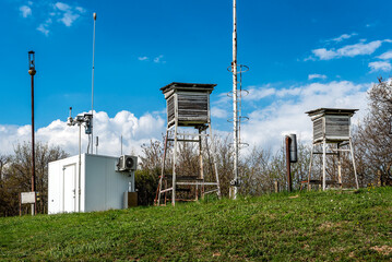 Weather station on the top of the hill in a summer Sunny day.
