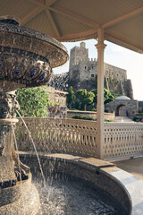 Beautiful fountain with splashes, aclove and castle on the background. Akhaltsikhe (Rabati) Castle,...