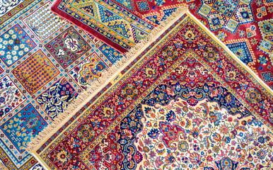 Background - randomly placed Persian carpets with abstract colorful patterns on the floor