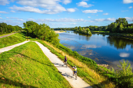 Chatilllon sur Loire, France - August 9, 2023: Cyclists ride on thefra cycle path along the Loire River in France.
