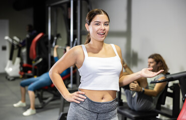 Portrait of slim woman smiling after a work out in gym
