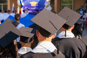 Graduates in quadrangles. Background with selective focus and copy space
