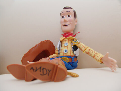 Curitiba, Paraná, Brazil - September 27, 2023: Woody model. Woody sits on a couch. Feeling relaxed.This figure from Disney Pixar inc
