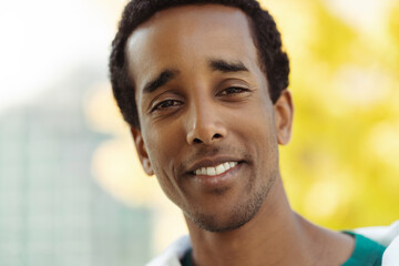 Closeup of handsome smiling african american man looking at camera