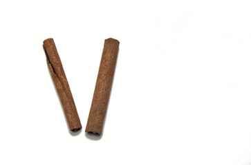 two cinnamon sticks isolated on a white background (spices for cooking cut out) pumpkin spice, indian food, pie, dessert