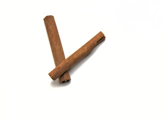 two cinnamon sticks isolated on a white background (spices for cooking cut out) pumpkin spice, indian food, pie, dessert