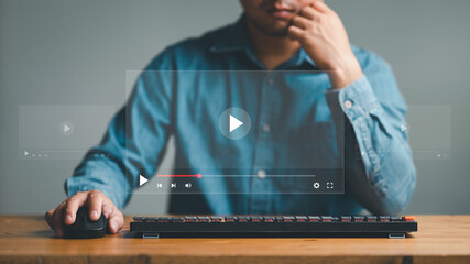 businessman using mouse and keyboard for streaming online on virtual screen, watching video on...
