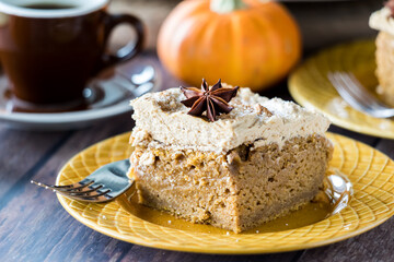 A slice of pumpkin spice latte cake with espresso flavoured frosting.