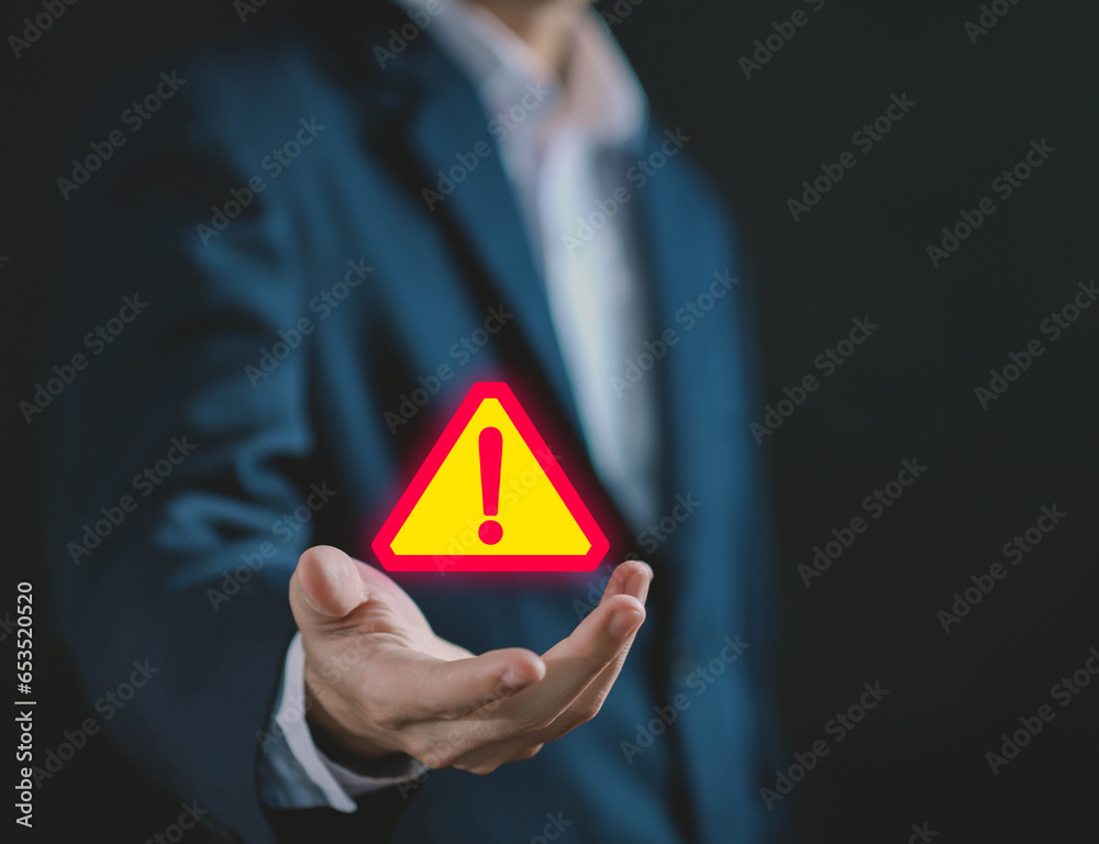 Wall mural hand shows a warning sign of system failure. concept caution danger if a computer is attacked cyber 