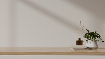 Empty space for your product display on a wooden tabletop against the white wall.