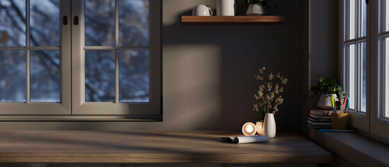 Empty space on a wooden tabletop against the wall and window in a modern living room in the evening.