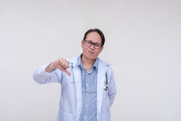 An unimpressed and dismissive doctor gives the thumbs down sign. Of asian descent, middle aged male...