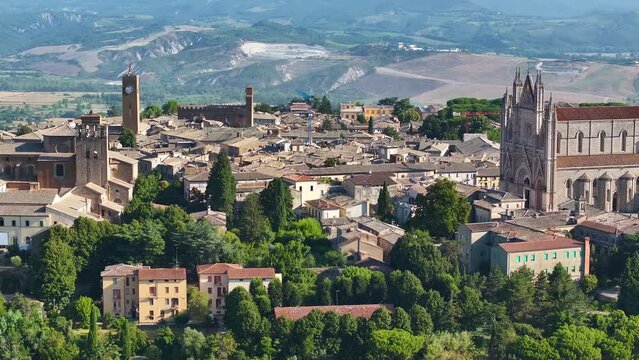 Aerial shot of Duomo di Orvieto or Cathedral of Orvieto, iconic Italian Gothic architecture in Umbria, Italy