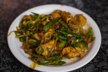 Indian Starter Chilli chicken, served on a plate. Selective focus