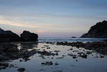 Fototapeta na wymiar Sunset on the peaceful beach 