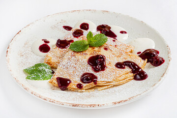 crepes with cherry jam and mint