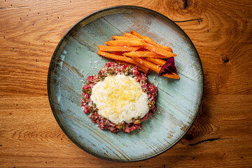 beef tartare with carrot and cheese