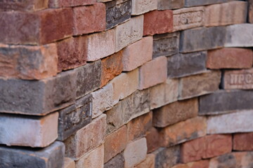 Bricks of different shades are laid on top of each other