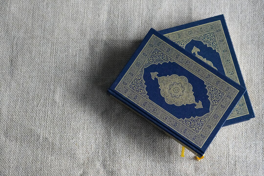 The Quran, also romanized Qur'an or Koran, is central religious text of Islam, believed by Muslims to be revelation from God (Allah). Classical Arabic. Sack, blue.