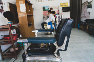 An old barber chair that has been in use for a long time at Baber Barber Shop.