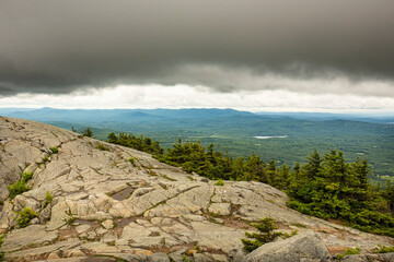 Dark clouds gathering at the granite summit of Mt. Kearsarge.