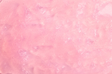 Cosmetic gel, serum transparent sample. Liquid cream with bubble texture. Gel texture of a cosmetic product. Clear liquid lotion for skin care.