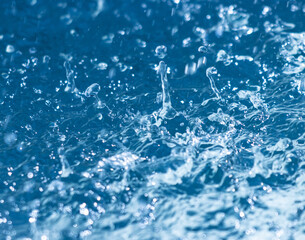 splashes and drops of water on the water.
