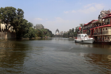 View of the River Nile with the Manial Street bridge (El Manial) leading to Roda Island in the background in Cairo, Egypt.