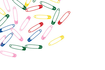 Multicolor safety pins isolated on white background. lots of colorful pins closeup