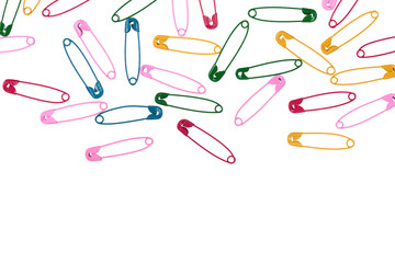 Multicolor safety pins isolated on white background. lots of colorful pins closeup