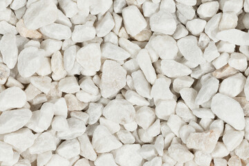 Fototapeta na wymiar White decorative gravel close up. marble chips stone fraction background texture. (