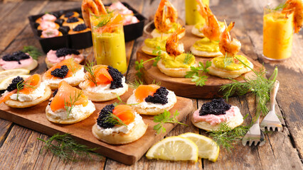 Festive christmas or new year canape- toast with avocado and grilled shrimp