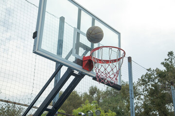 Ball in basketball hoop. Sport. Hobby. Lifestyle